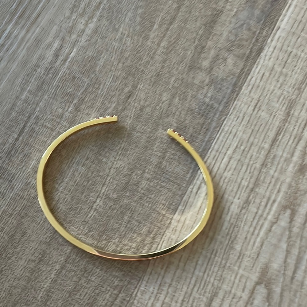 A gold bracket with real gems